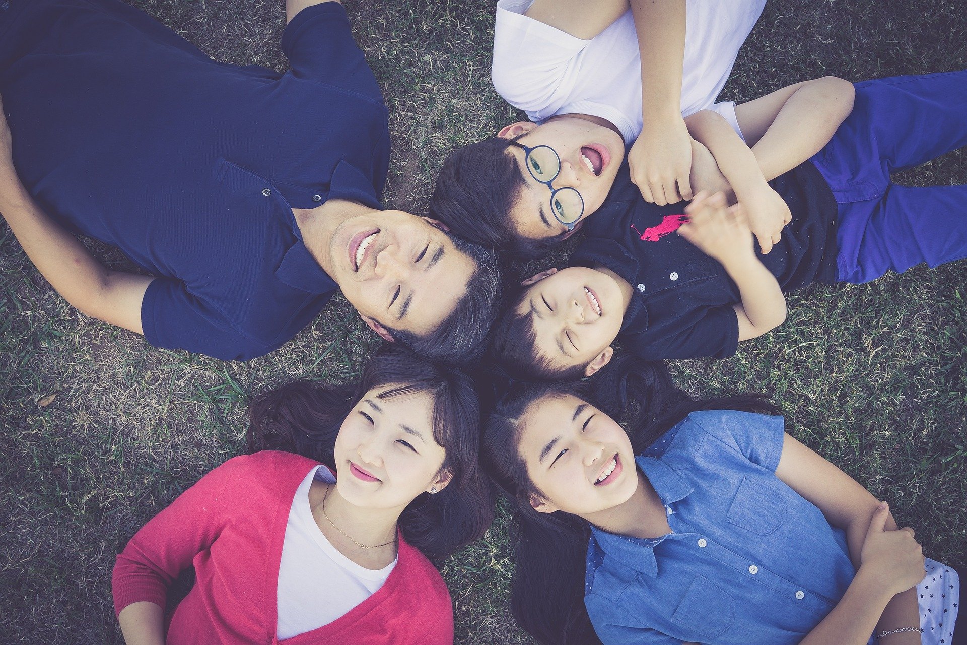 Family laying on grass photo - Original reference for coloring page